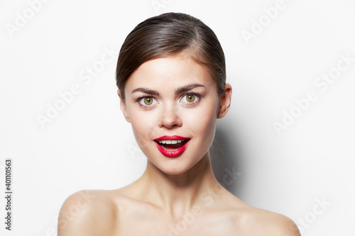 Beautiful woman Nude shoulders red lips surprised look close-up clear skin 