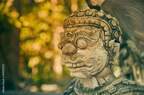 Phayao, Thailand - Nov 22, 2020: Right Frame Headshot Titan or Giant in Analayo Temple or Wat Analayo on Blurring Background in Vintage Tone photo