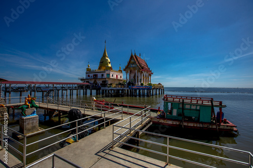 Background of important religious attractions (Wat Hong Thong), a large pagoda on the water, people popular for making merit during holidays in Chachoengsao Province of Thailand.