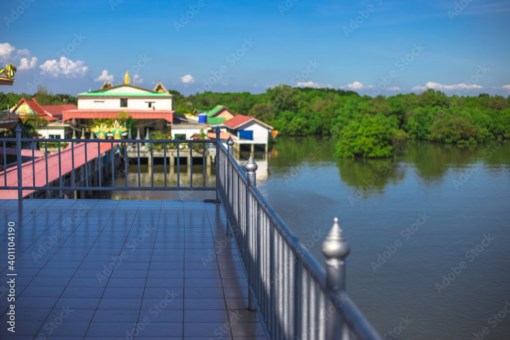Background of important religious attractions (Wat Hong Thong), a large pagoda on the water, people popular for making merit during holidays in Chachoengsao Province of Thailand.