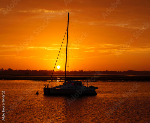 Boat At sunrise on the water Gold Coast Queensland Australia © David