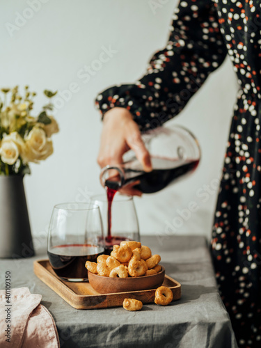 Taralli or tarallini and wine glass on the table photo