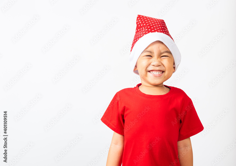 Portrait of Asian little cute boy smile and excited, Kid dressed in red Santa Claus hat the concept of holiday Christmas Xmas day or Happy new year, studio shot isolated on white backgroun Portrait of Asian little cute boy smile and excited, Kid dressed in red Santa Claus hat the concept of holiday Christmas Xmas day or Happy new year, studio shot isolated on white backgroun