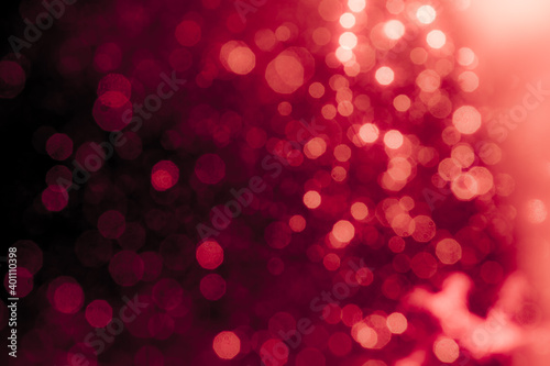 Red light glowing defocused holiday blurr bokeh in black
