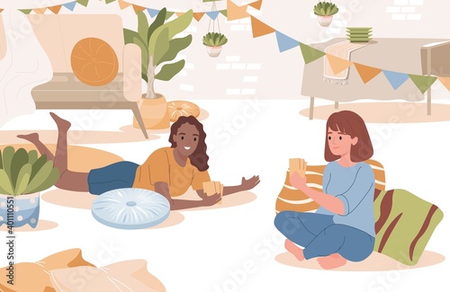 Friends playing cards vector flat illustration. Happy smiling girls sitting on the floor in living room and playing board game together. Home leisure activity, friends entertainment.