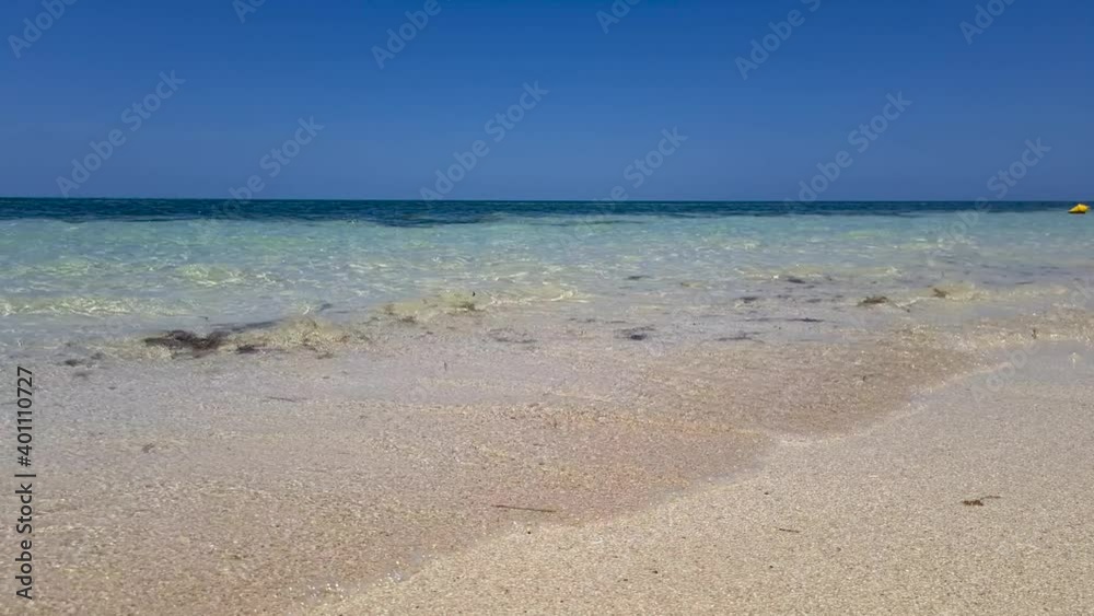 Waves Gently Breaking On Beach. Low Angle, Locked Off Waves Gently Breaking On Beach. Low Angle, Locked Off