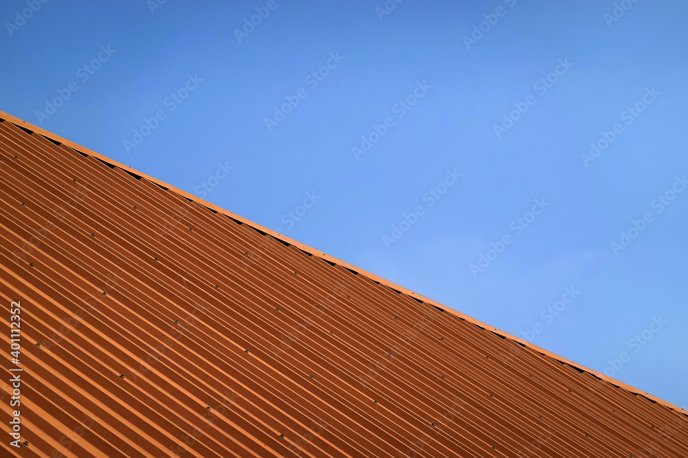 Brown metal steel plate for background. Blue sky background. Brown metal steel plate for background. Blue sky background.