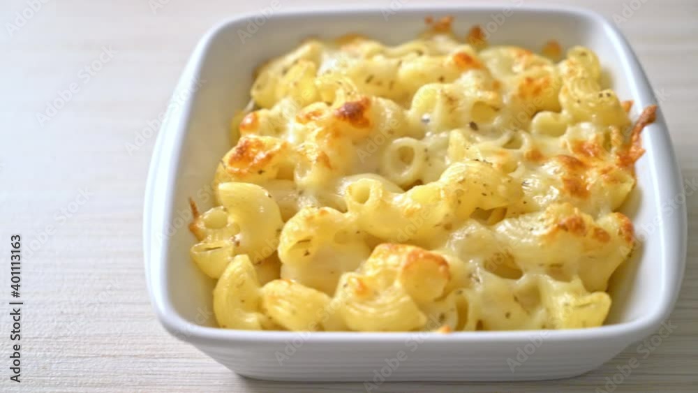 mac and cheese, macaroni pasta in cheesy sauce - American style mac and cheese, macaroni pasta in cheesy sauce - American style