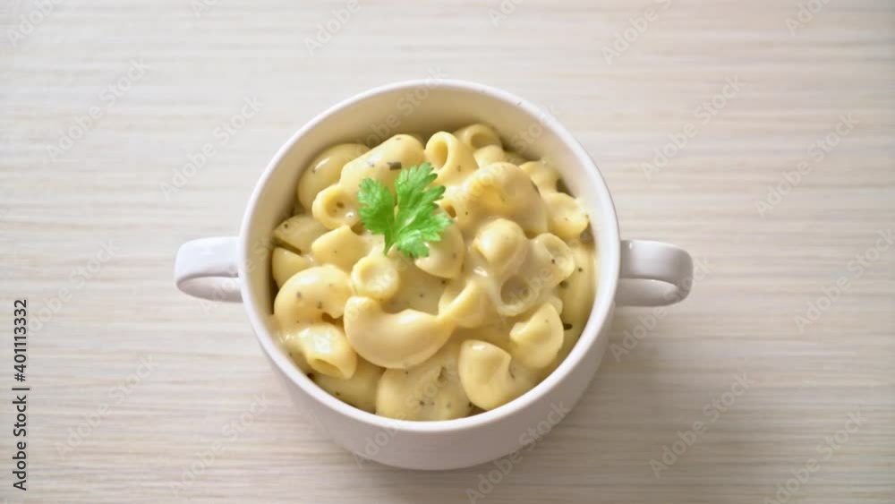 macaroni and cheese with herbs in bowl macaroni and cheese with herbs in bowl