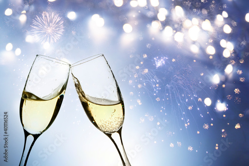Two glasses of champagne in new year fireworks