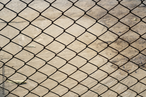 Wire fence or metal net on Cement floor background