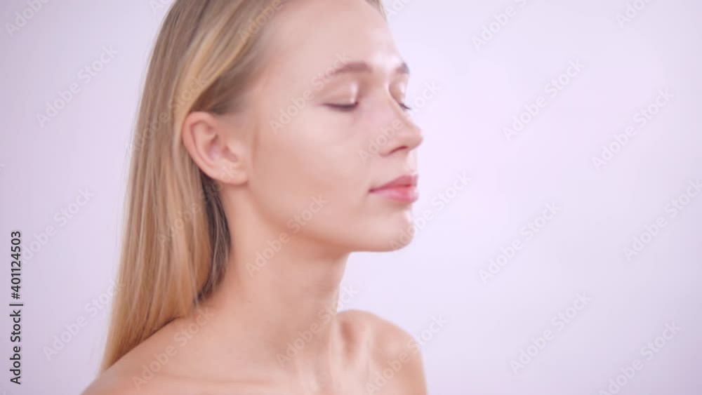 Makeup artist applies cosmetics with a special brush Makeup artist applies cosmetics with a special brush