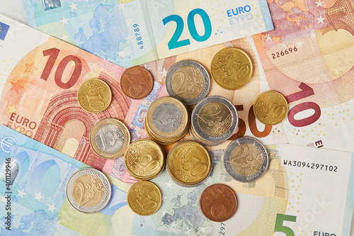 Money background. 20, 10 and 5 Euros in paper money and various coins euro cents macro close up 