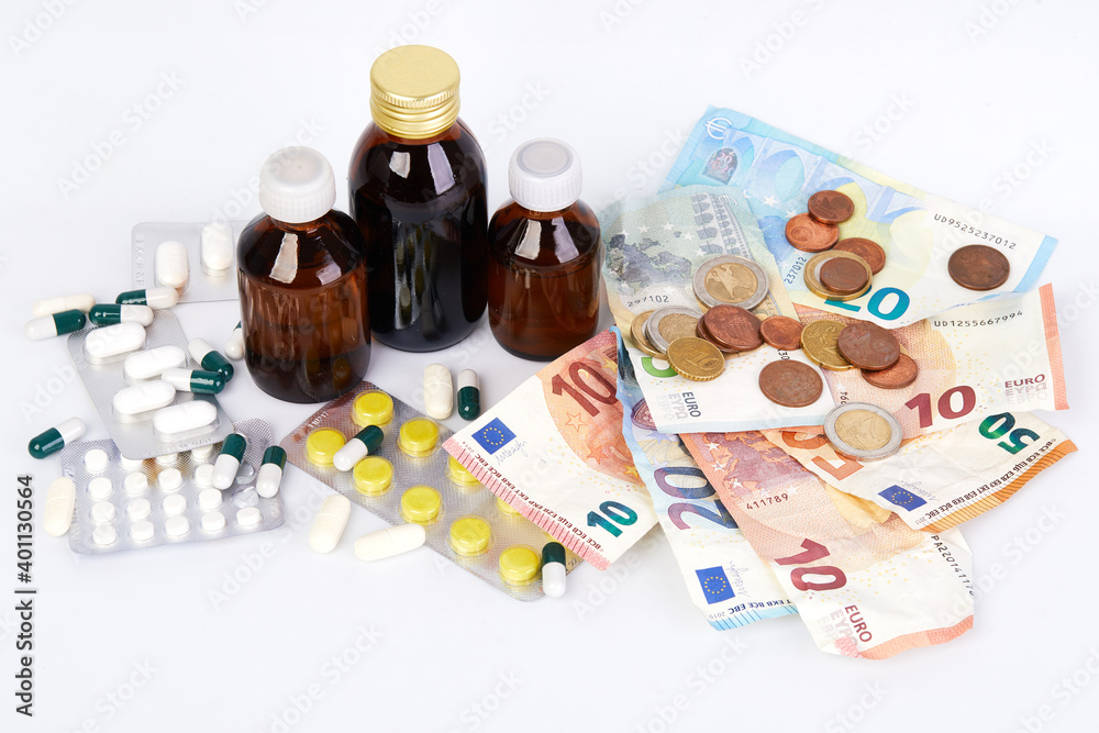 Euro paper money, various coins cents and different medicines in tablets and bottles on a white background Euro paper money, various coins cents and different medicines in tablets and bottles on a white background