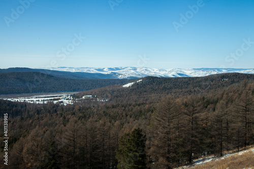Panorama of winter mountains with forest