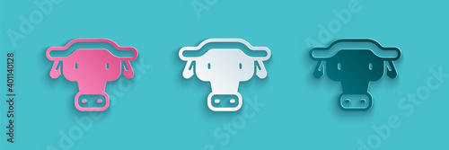 Paper cut African buffalo head icon isolated on blue background. Mascot, african savanna animal. Wild ox, carabao or bison bull with fused horns. Paper art style. Vector.