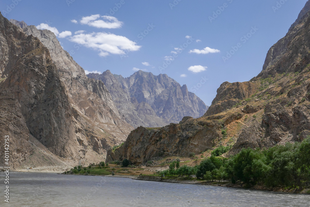 Beautiful rocky landscape view along the Pamir Highway of the Panj river valley between Afghanistan and Tajikistan in Vanch district, Gorno-Badakshan, Tajikistan