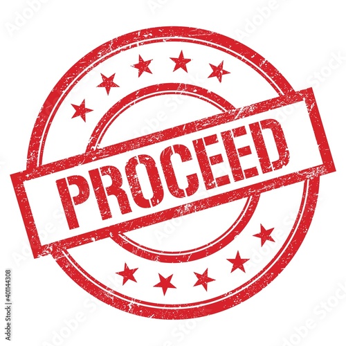 Fotografia PROCEED text written on red vintage stamp.