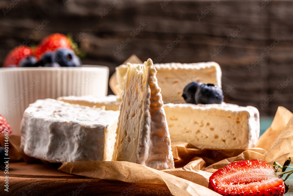 Fresh strawberries and brie cheese wooden board. banner menu recipe place for text Fresh strawberries and brie cheese wooden board. banner menu recipe place for text
