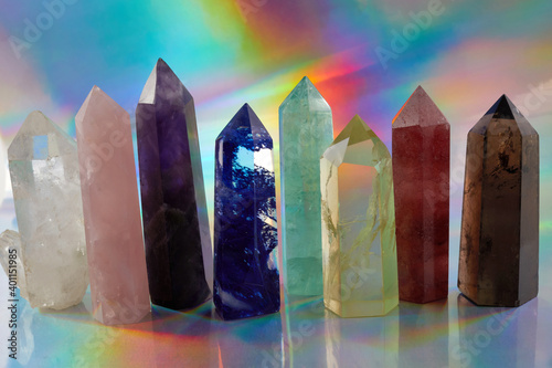 Photography Healing Chakra crystals on halographic background