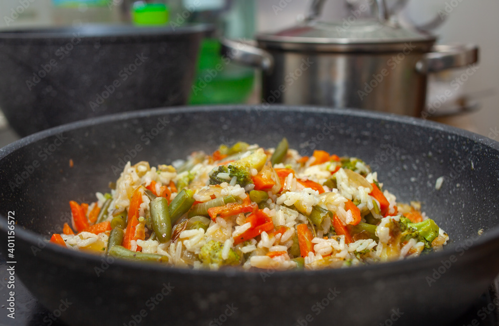 rice with fried vegetables in a pan, home cooking rice with fried vegetables in a pan, home cooking