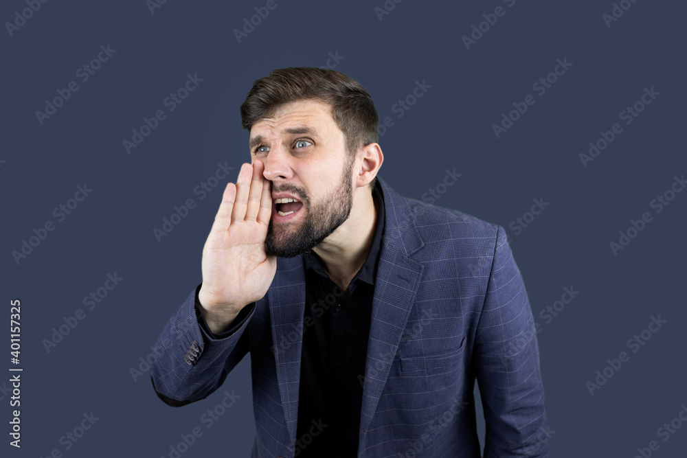 a businessman in a blue suit puts his hand to his mouth and shouts a businessman in a blue suit puts his hand to his mouth and shouts