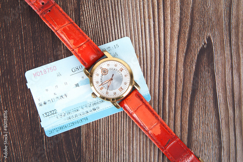 Train ticket and watch on it