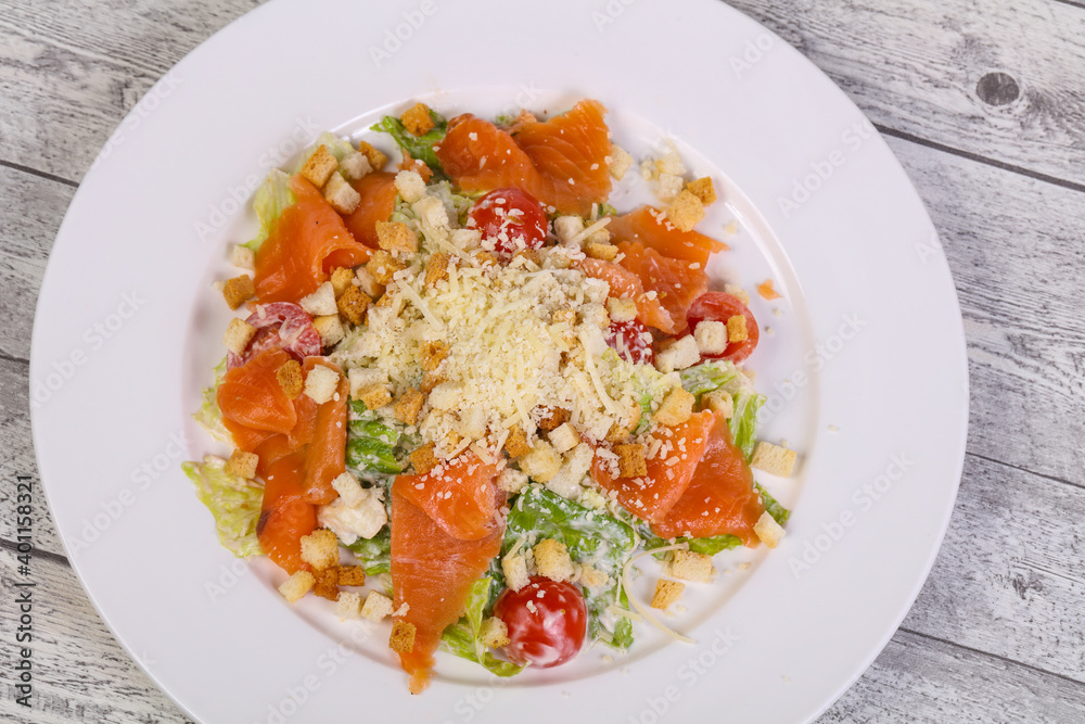 Caesar salad with salmon and parmesan