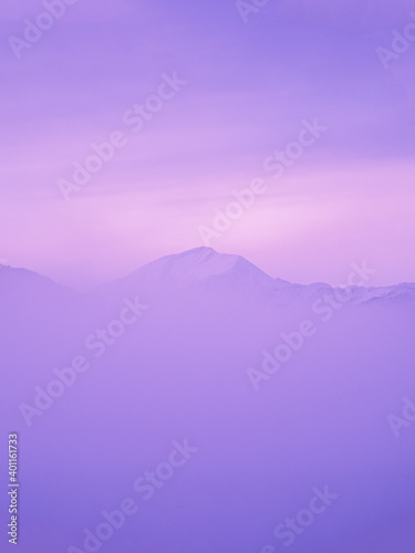 Fantastic mountain covered with purple mist, fabulous surreal inspiration landscape