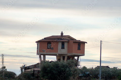 concrete stilt house facing the sea