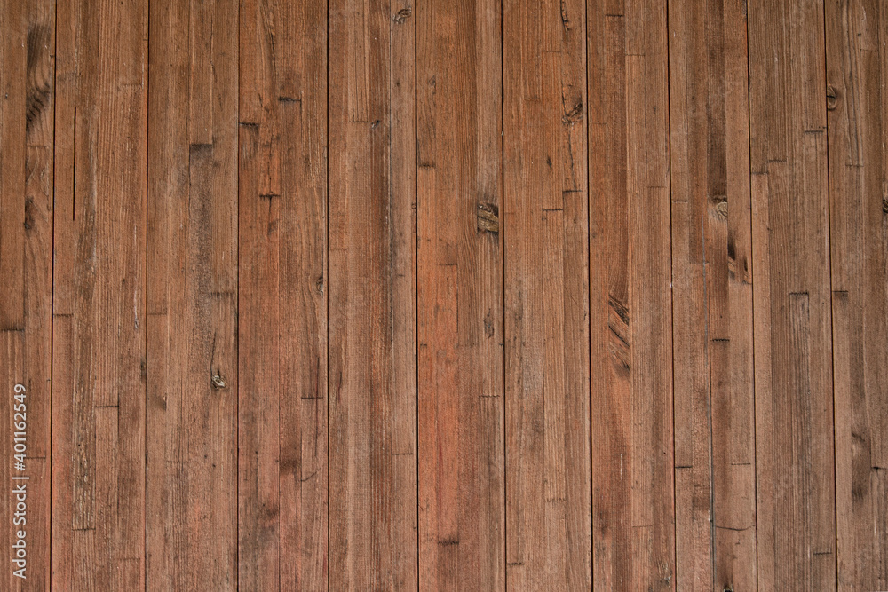 Fototapeta premium Background from narrow vertically arranged wooden planks with copy space. Wood texture.
