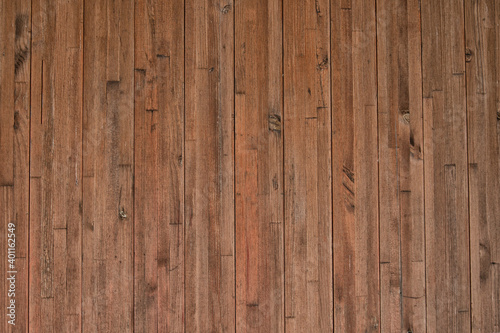 Background from narrow vertically arranged wooden planks with copy space. Wood texture.