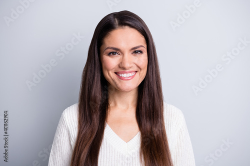 Portrait of attractive cheerful content brown-haired mature girl isolated over grey pastel color background