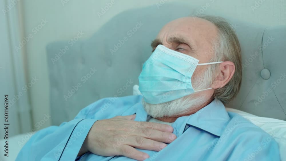 Old man in protective mask coughing, shortness of breath, symptom of coronavirus