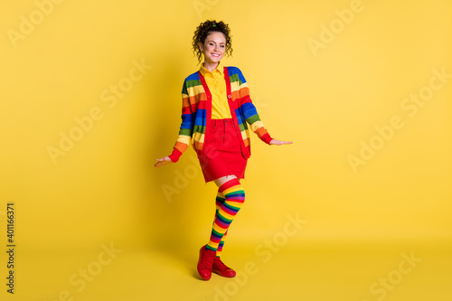 Full length body size view of pretty cheerful wavy-haired wear cosy garment posing isolated bright yellow color background