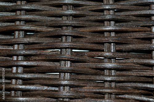 Brown horizontal woven rattan texture. Abstract background. Closeup. Green ecological natural  materials. 