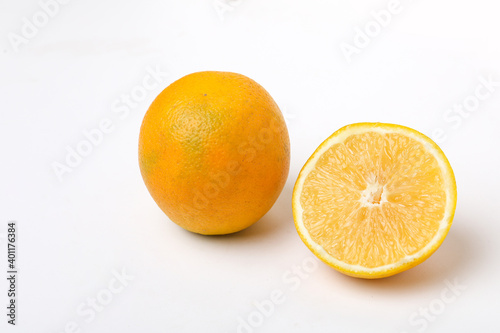 Fresh Half cut sweet lemon or mosambi fruit on white background photo