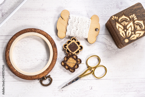 Accessories for hobby. Hoop snaps, threads, needles and scissors. Vintage tools for embroidery and knitting