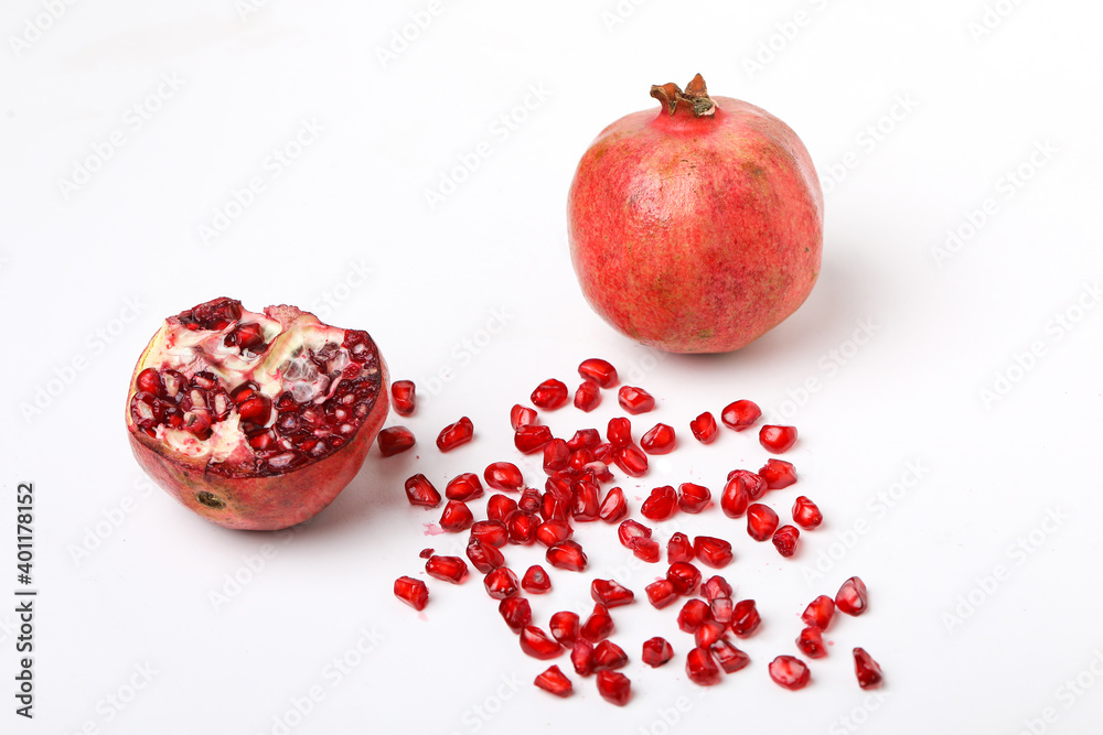 Fresh pomegranate with slice on white background Fresh pomegranate with slice on white background