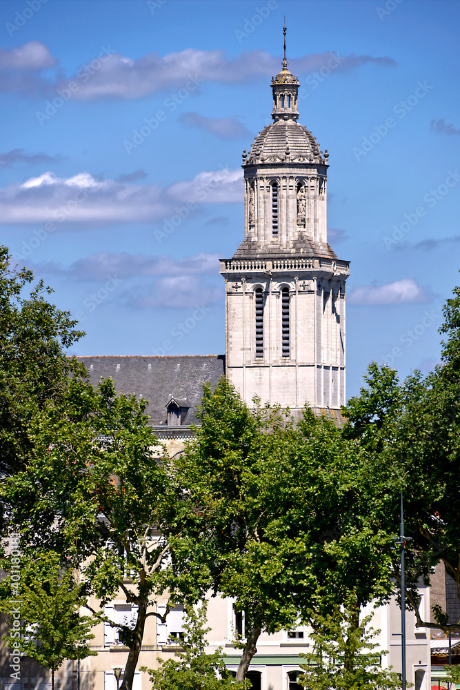 Bell tower La Trinité Church among the trees in the city of Angers in the Maine-et-Loire department, Pays de la Loire region, in western France about 300 km (190 mi) south-west of Paris