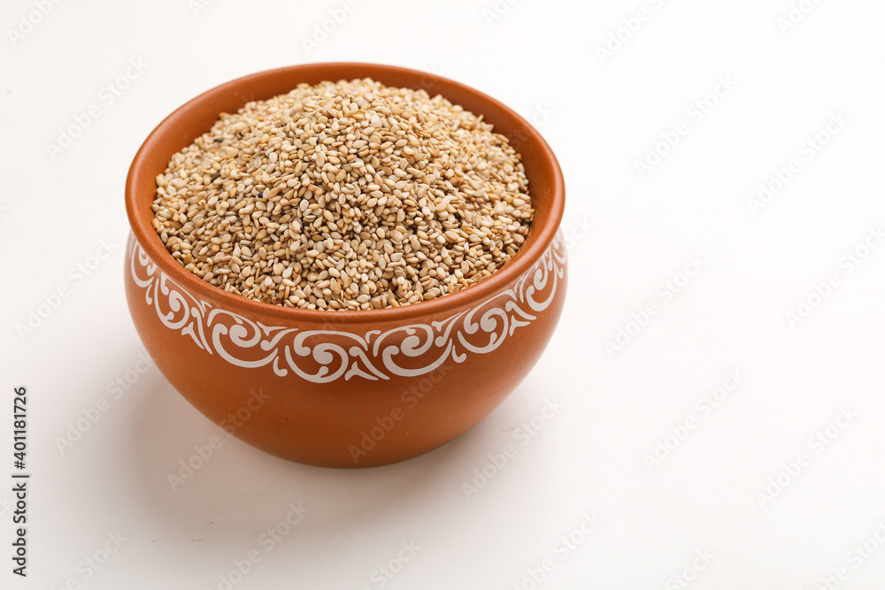 Sesame seed in bowl on white background Sesame seed in bowl on white background