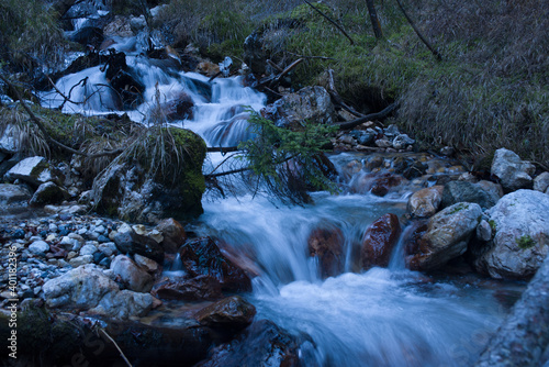 the silky effect that is created in winter on a stream in the middle of the woods in a mountain location 