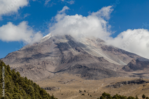 A beautiful shot of the Pico de Orizaba volcano in Mexico. Relief highest mountain and a forest