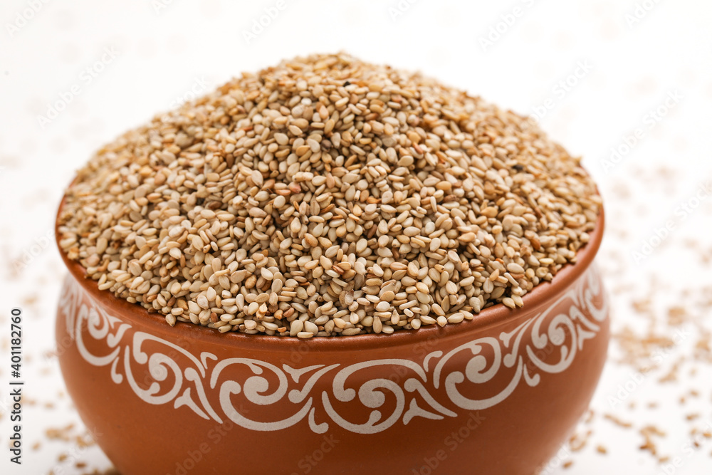 Sesame seed in bowl on white background Sesame seed in bowl on white background