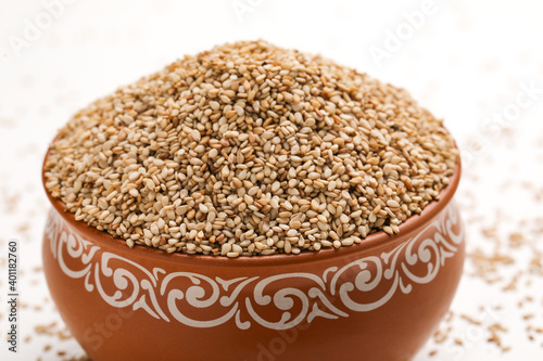 Sesame seed in bowl on white background