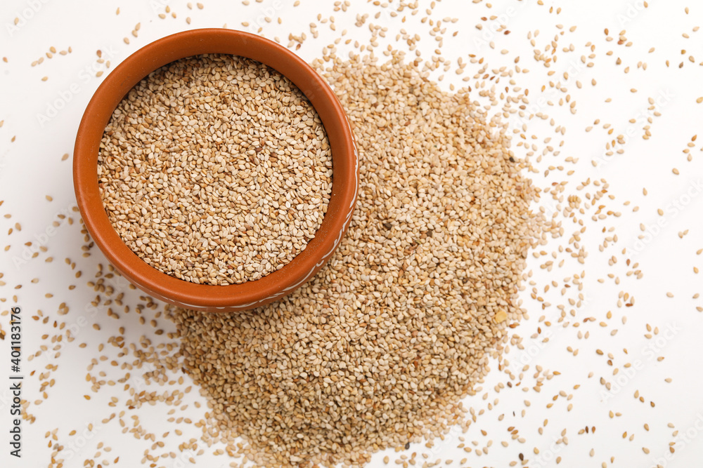 Sesame seed in bowl on white background Sesame seed in bowl on white background