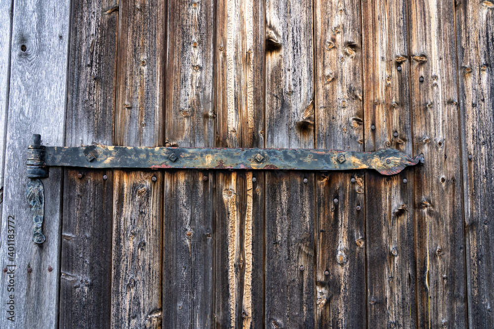 wooden door of a characteristic stable for German moorland sheep in the natural preserve Lueneburger Heide wooden door of a characteristic stable for German moorland sheep in the natural preserve Lueneburger Heide