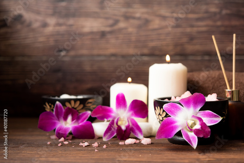 Thai Spa Treatments aroma therapy salt and nature sugar scrub massage with orchid flower with candle. Thailand. Healthy Concept.
