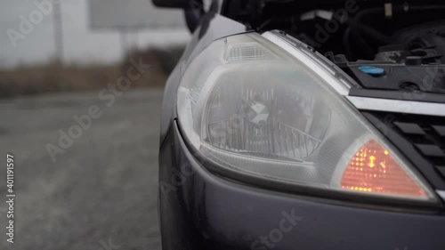 Wallpaper Mural Flashing car headlight bulb - close-up view. Torontodigital.ca