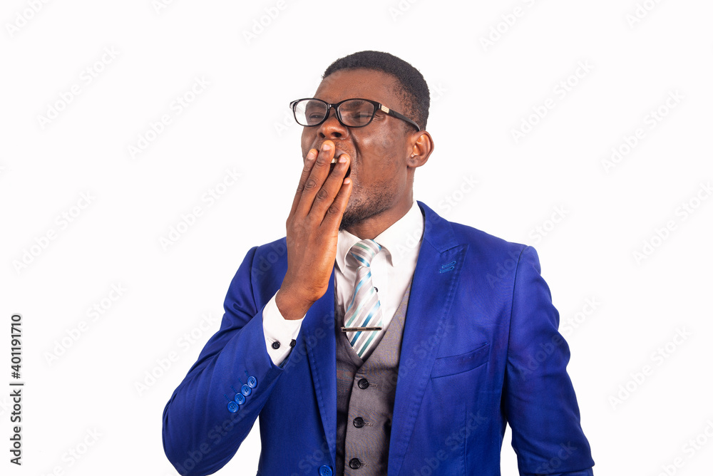 portrait of a handsome young businessman in suit, yawning portrait of a handsome young businessman in suit, yawning